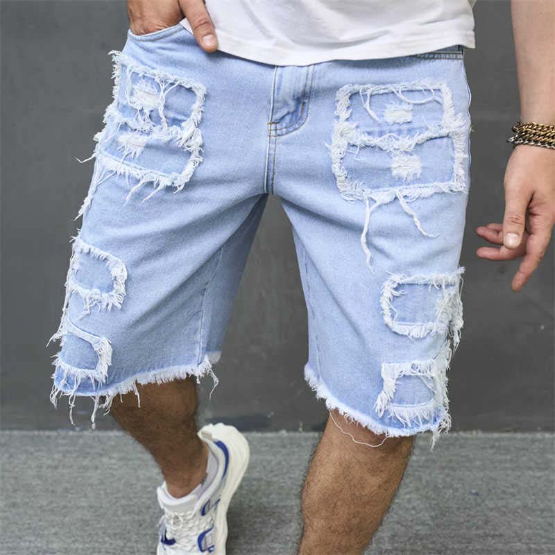 Ripped Denim Shorts with Frayed Details